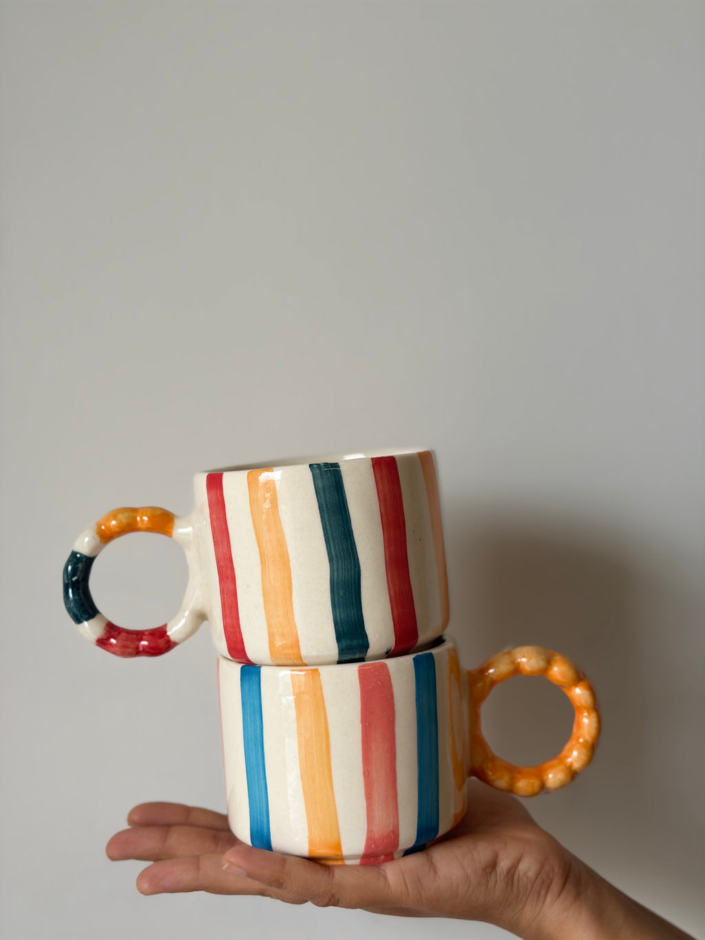 Colourful striped mug, colourful handle